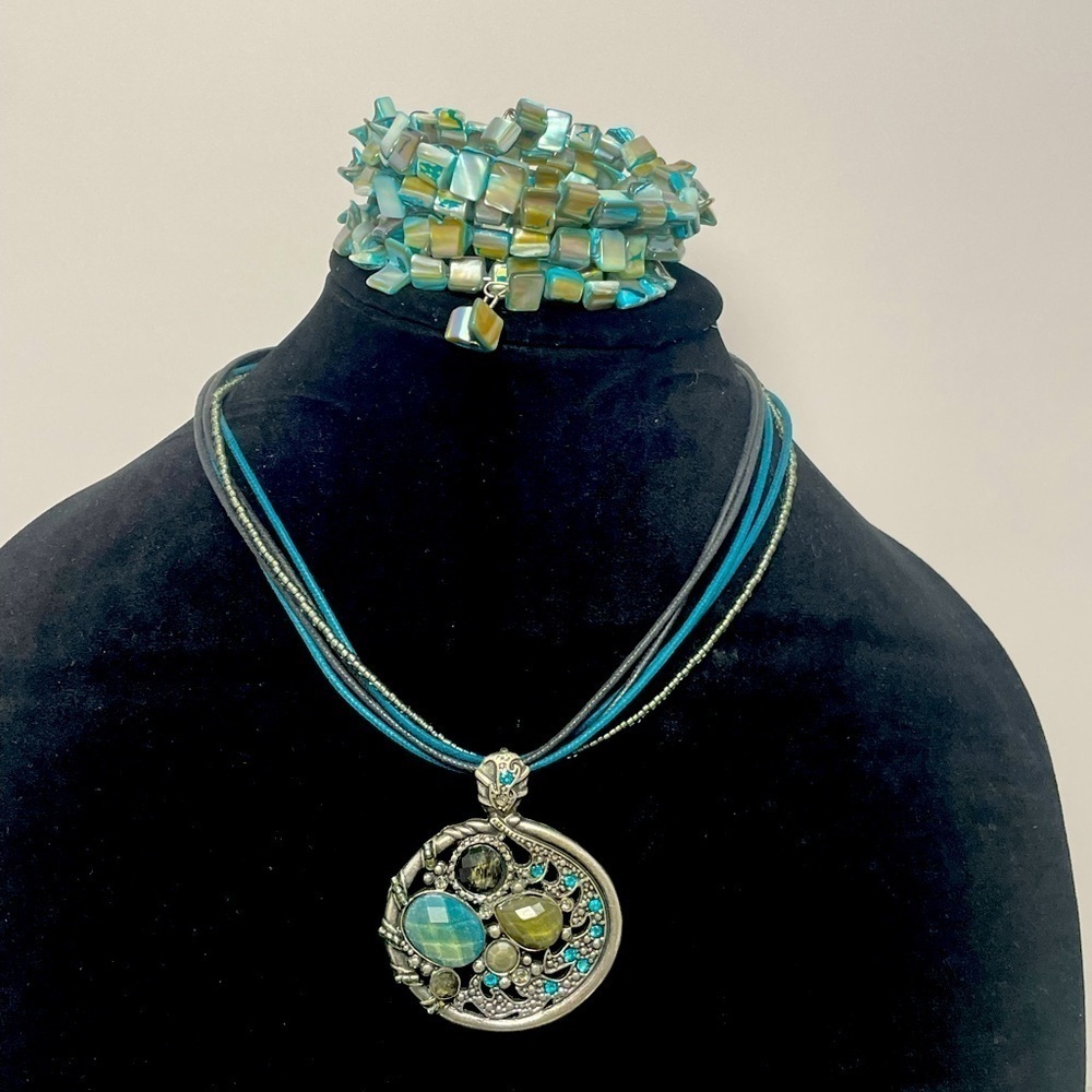 Leather and beaded pendant necklace and stone wrap bracelet.